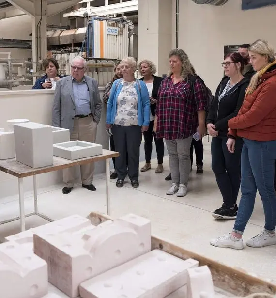A group of people standing in a room.