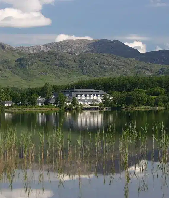 A house on a small island surrounded by water.